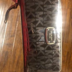 Silver Michael Kors Wallet. Lots of space.